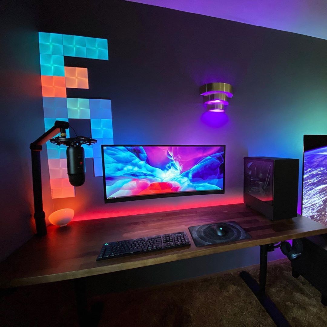Gamer focused on monitors in professional workspace environment